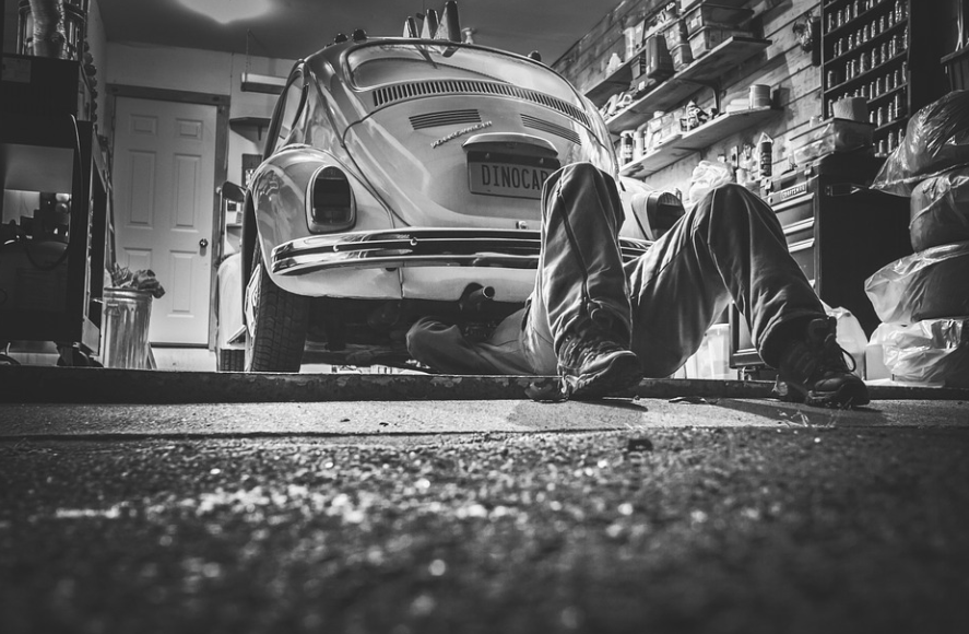 mechanic checking a car