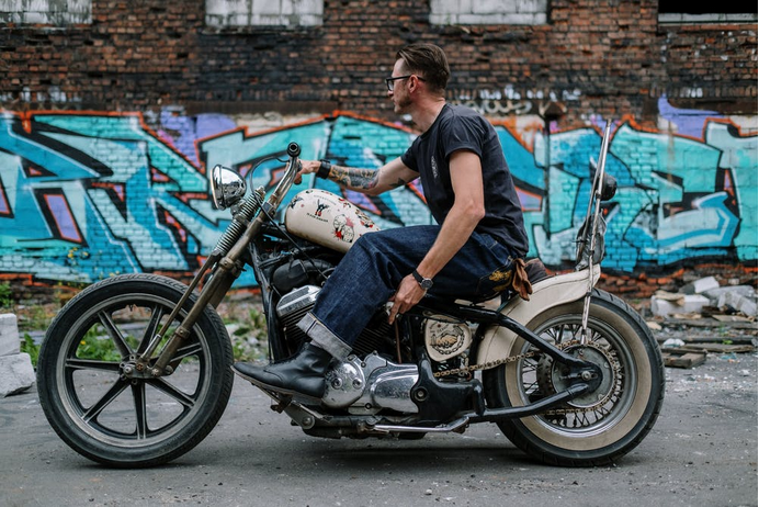 a man with a motorbike